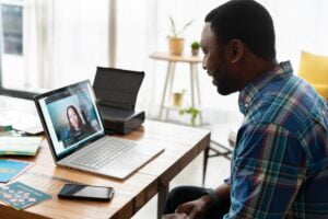 Photographer on a video call with client