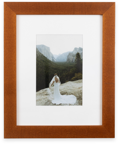 Photograph of bride in a beautiful wood frame